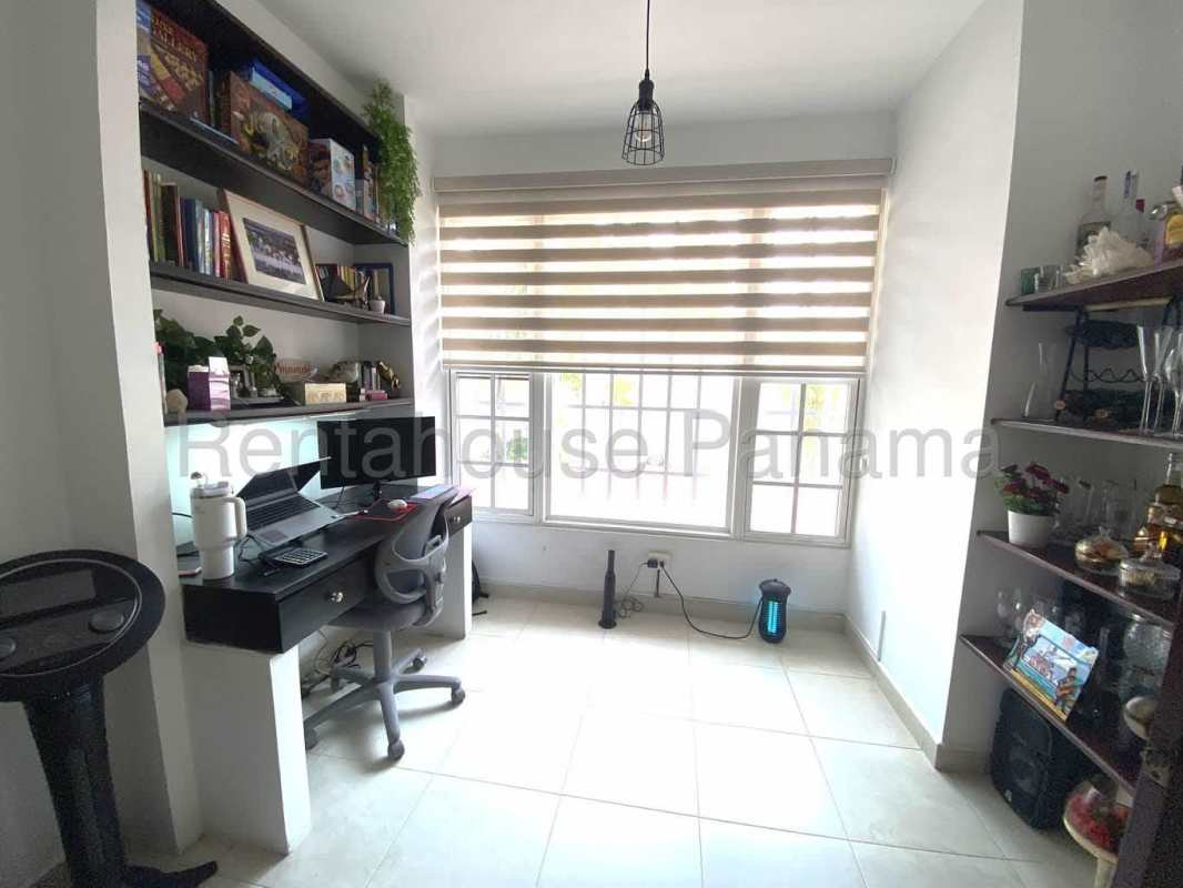 Covered patio with barbecue grill and outdoor dining area in Villa Valencia Costa Sur Panama City