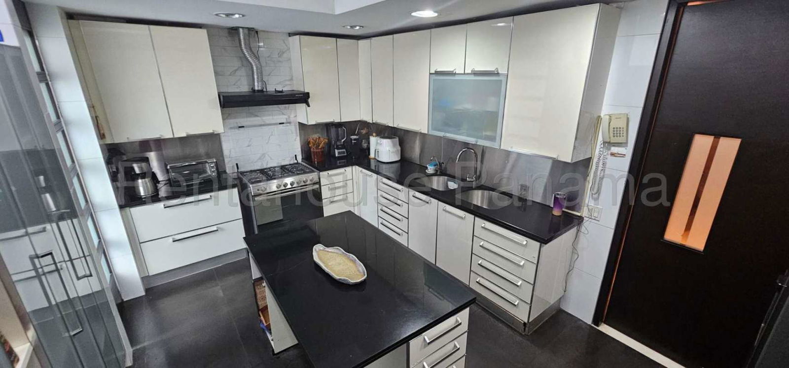 Living and dining area with floor-to-ceiling windows ocean views in PH Pacific Point Punta Pacifica Rental