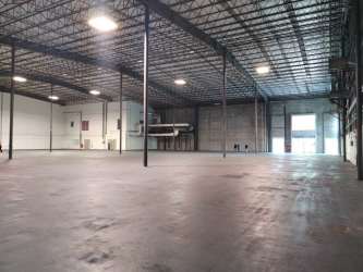 Interior of warehouse with pallet racks and wide storage aisle in Panama Pacifico Free Zone