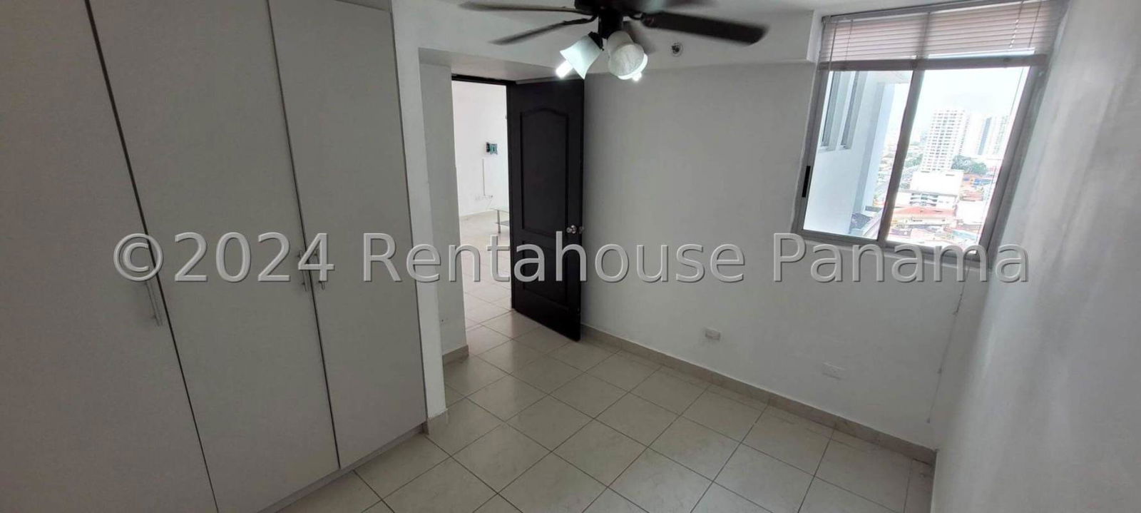 Kitchen with granite countertop, tiled floor and appliances in PH Riverside Parque Lefevre Panama