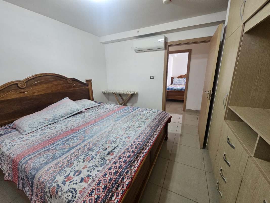 Bedroom with air conditioning, closet, window with curtains furnished apartment PH Rokas Condado del Rey