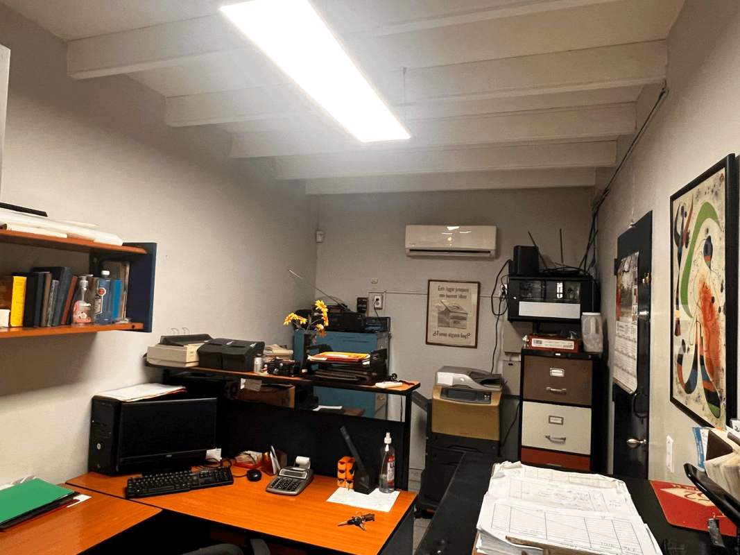 Reception with window service area, colorful chairs in commercial property Panama City