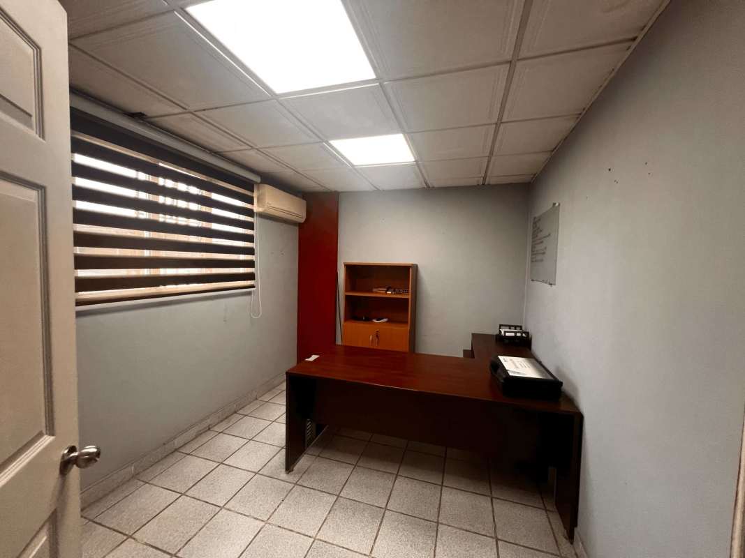 Modern open office with geometric wall and open stair in commercial rental Llano Bonito Panama