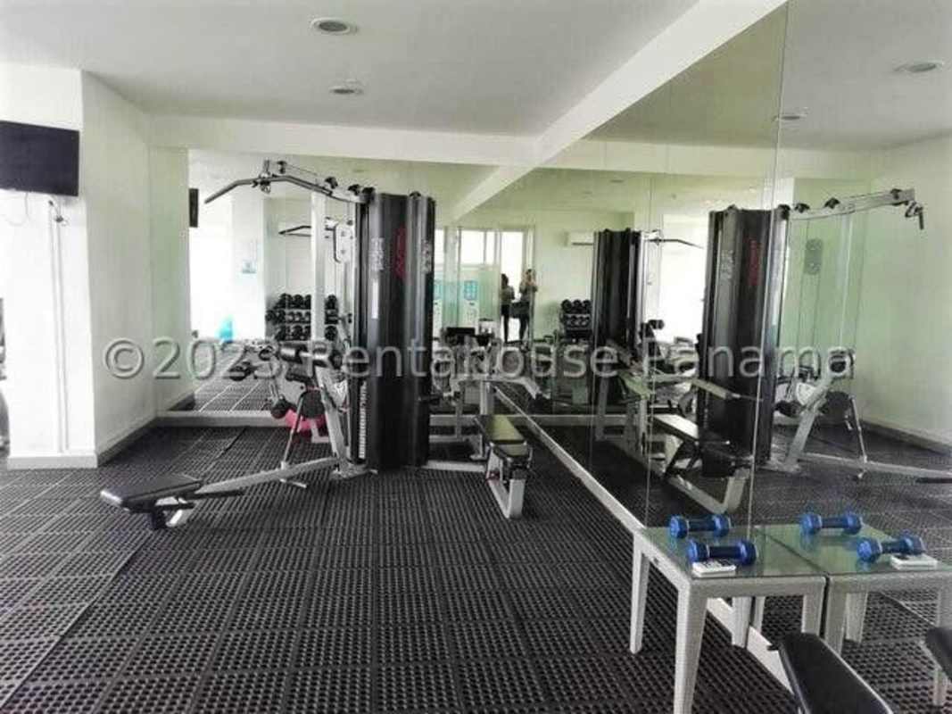 Spacious bedroom with built-in closet and ocean view window in PH Bahia del Golf Panama City