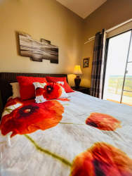Dining space with wicker chairs and ceiling fan Villa Azul Playa Blanca