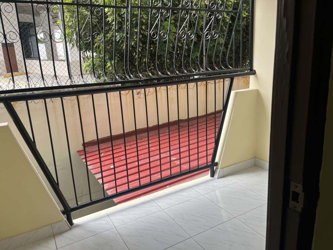 Balcony with black railing and garden outlook in apartment for sale Betania Panama