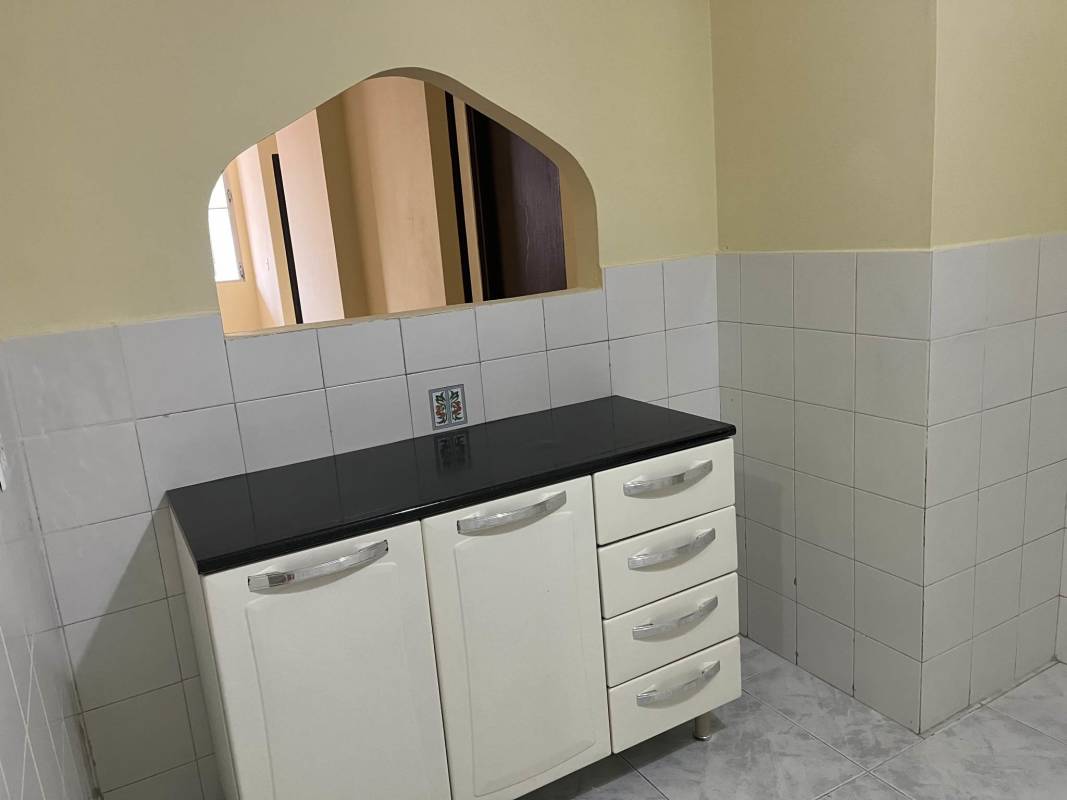 Minimalist bedroom with marble tiles barred windows in apartment Betania Panama