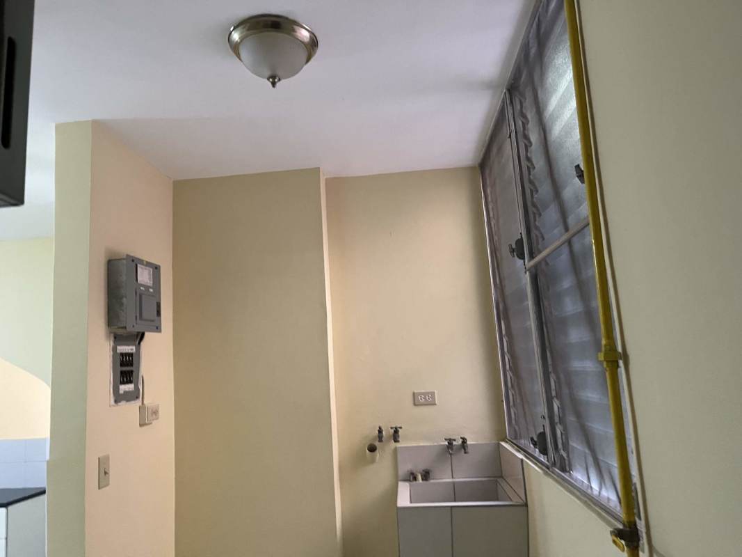 Small bathroom featuring wall sink mirror cabinet black trim Betania Panama