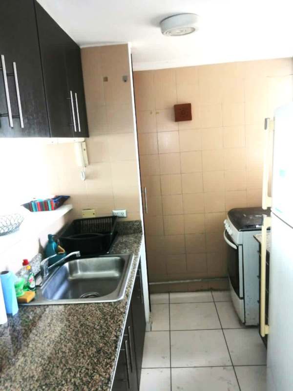 Open kitchen with granite countertops gas stove PH Paitilla Tower Panama