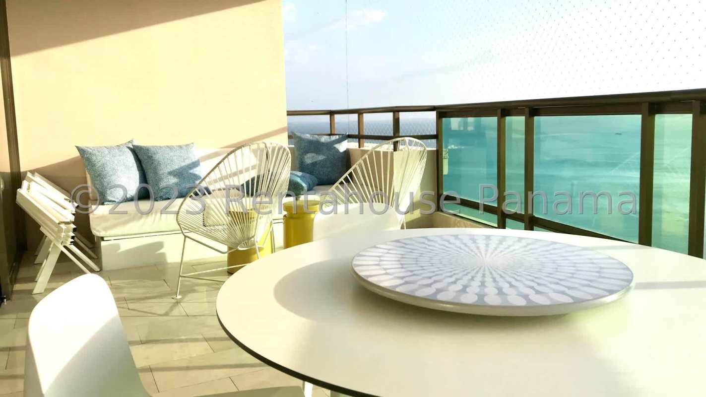 Large ocean view balcony with seating area and BBQ in PH Ocean Club Punta Pacifica Panama