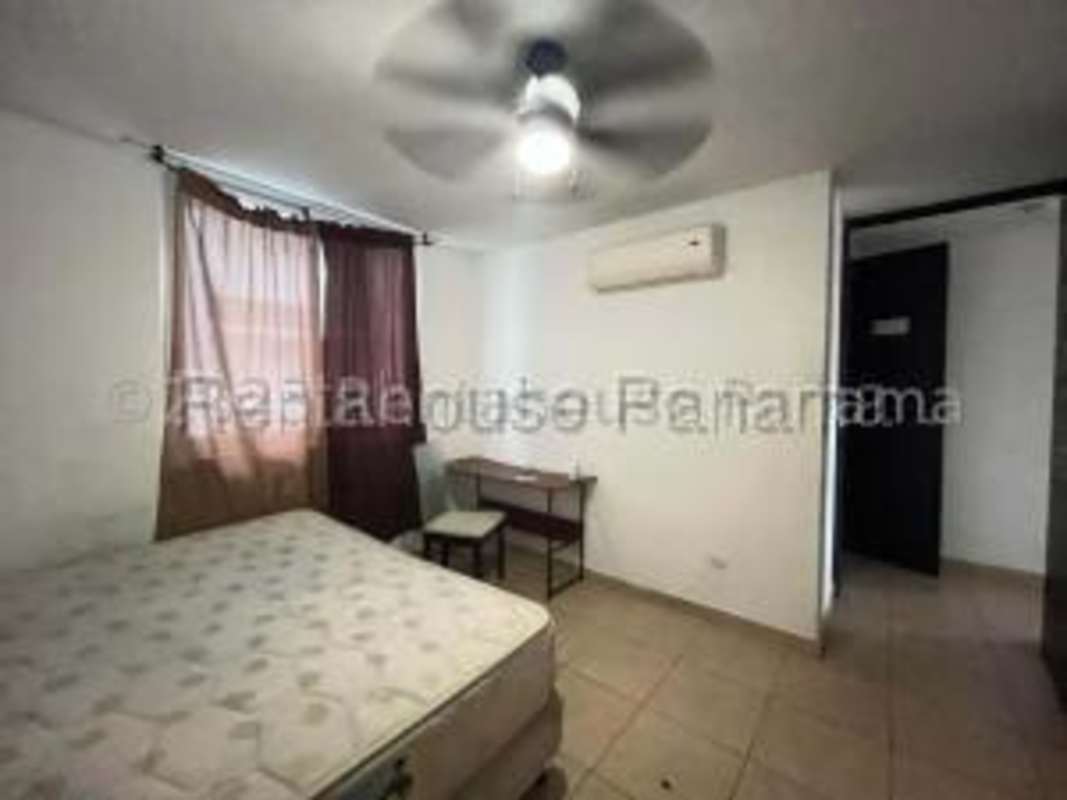 Standard kitchen with tile backsplash, appliances and cabinets at Cosmopolitan Tower Panama rental