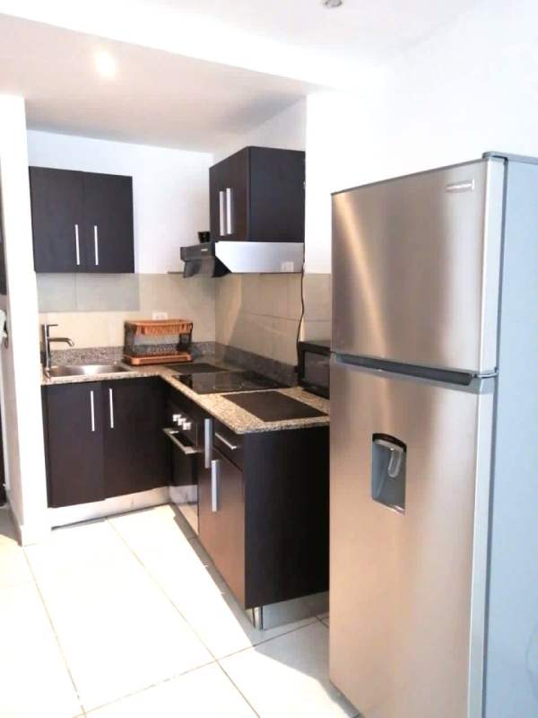 Lobby with mural artwork and reception desk PH Miramar Panama City