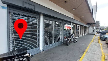 Glass facade and metal shutters of ground floor retail unit in Nuevo Arraiján