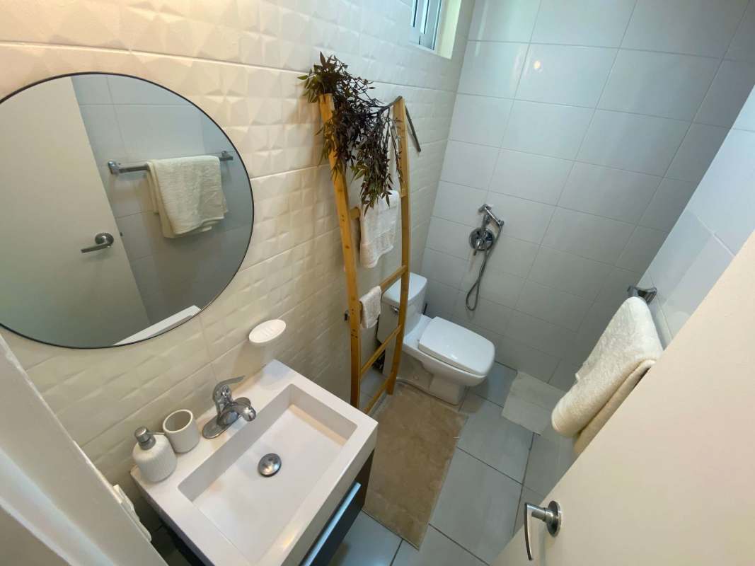 Contemporary bathroom with walk-in shower, sink and mirror in PH Carrasquilla Tower Panama