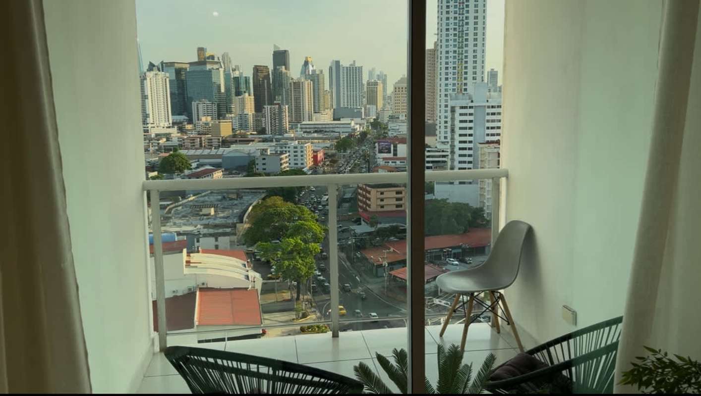Private balcony with skyline view and outdoor seating in PH Carrasquilla Tower Panama City
