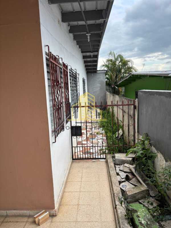 Long kitchen with cabinets and tile backsplash in Panama City house rental