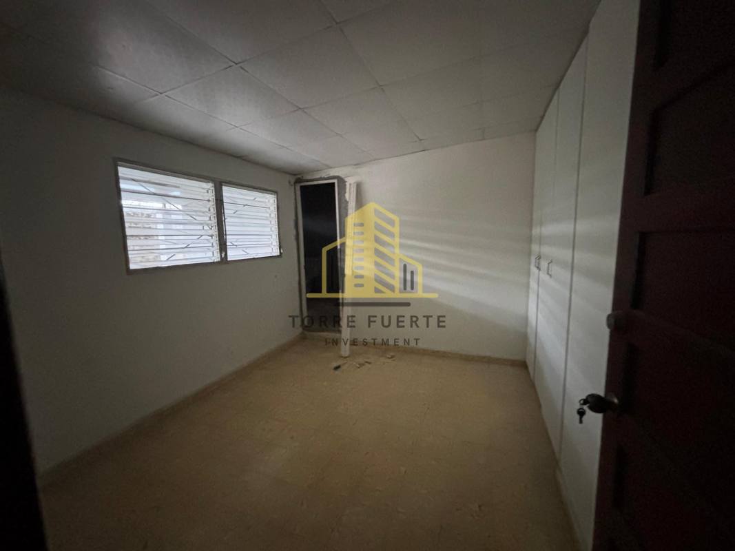 Empty bedroom with built-in wardrobe and tiled flooring in Cerro Viento house