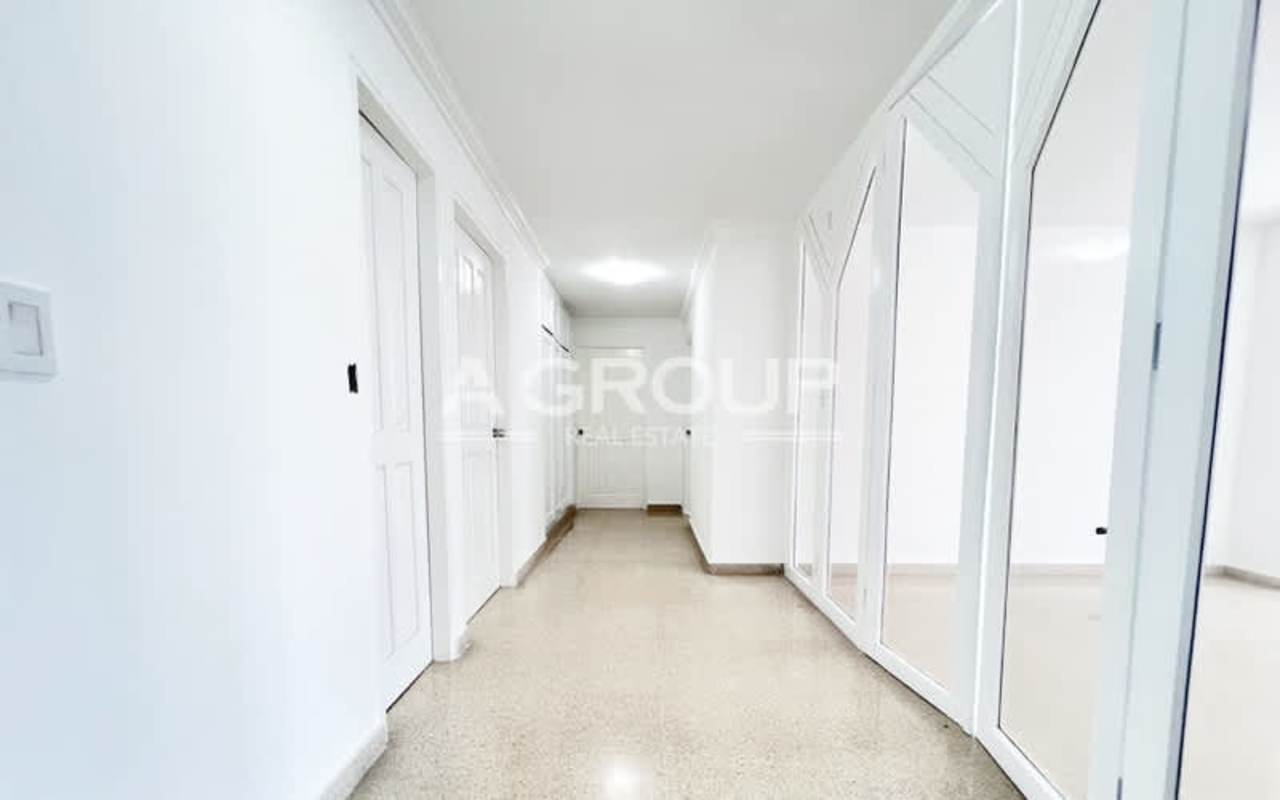 Spacious kitchen with island, windows and cabinetry in PH Savoy Punta Paitilla Panama City