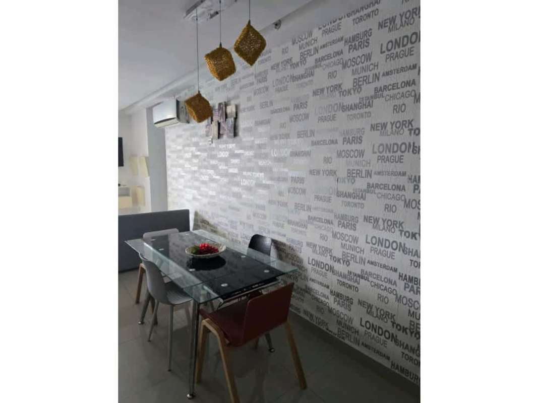 Dining space city wallpaper glass table pendant lights PH Diamond San Francisco Panama City