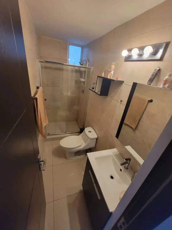 Modern bathroom with glass shower and single vanity at PH Coral Towers Carrasquilla Panama