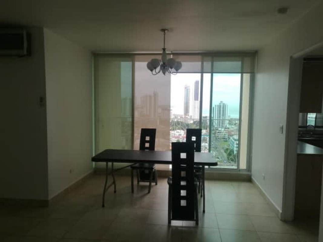 Contemporary dining space with large windows and skyline views in PH Porto Fino San Francisco Panama