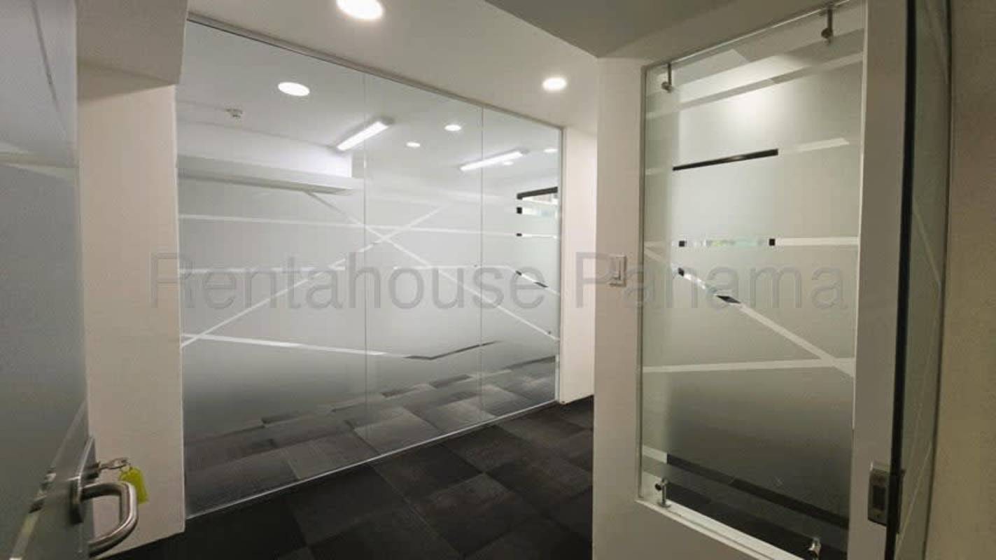 Open floor office with modern carpet tiles and frosted glass Marbella Business Center Panama City