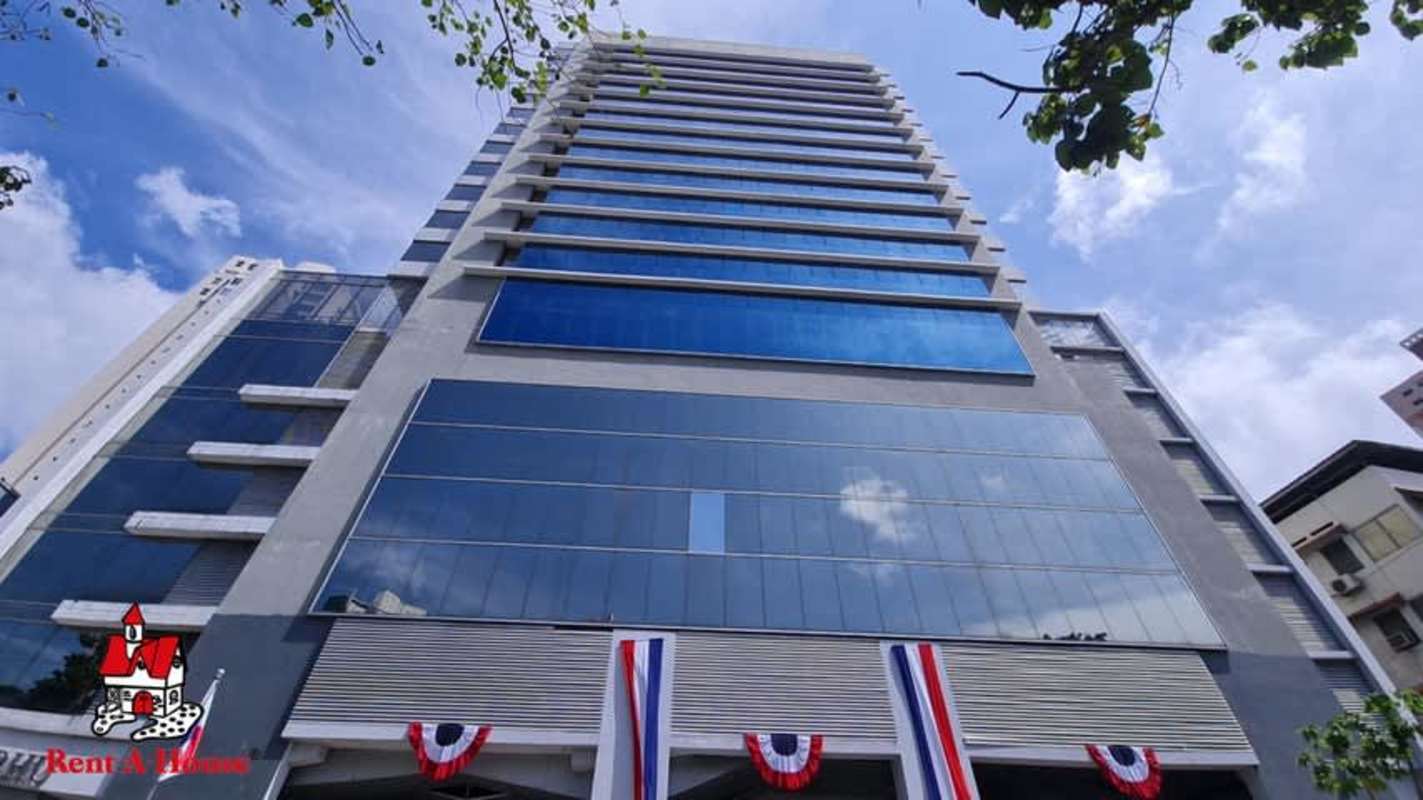 Urban street entrance to PH Business Tower commercial building