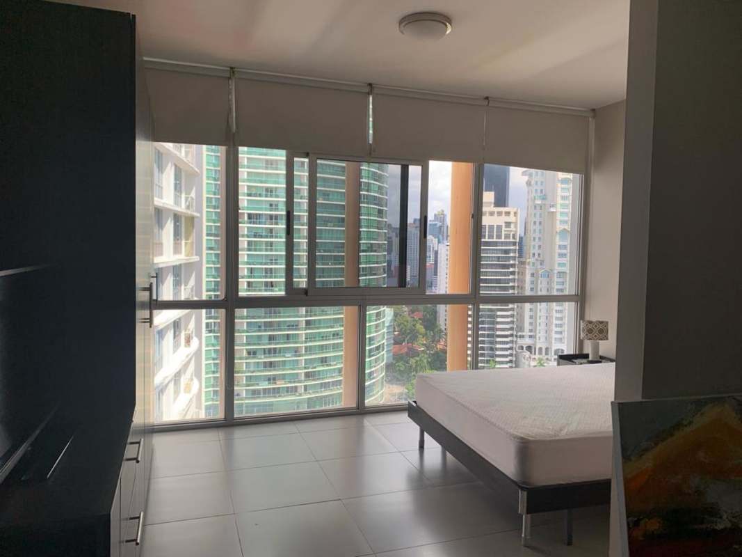 Studio bedroom with large windows, city view, minimal decor in PH De Colores, Bella Vista, Panama City