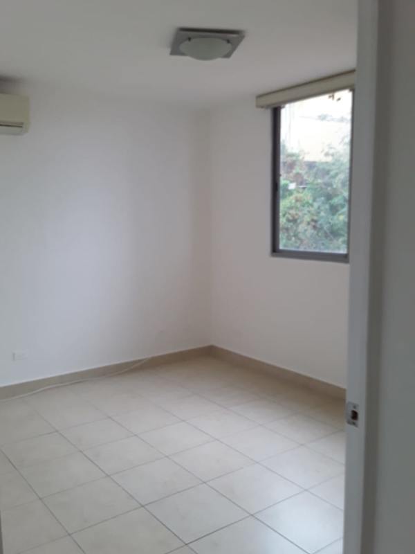 Empty bedroom with tiled floors and window PH Villa de las Fuentes Panama