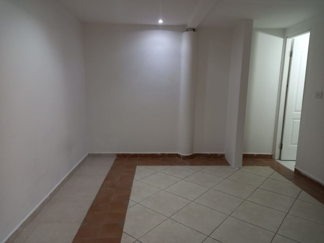 Open living area with ceramic tile floors and ceiling fans in Condado del Rey family house Panama City
