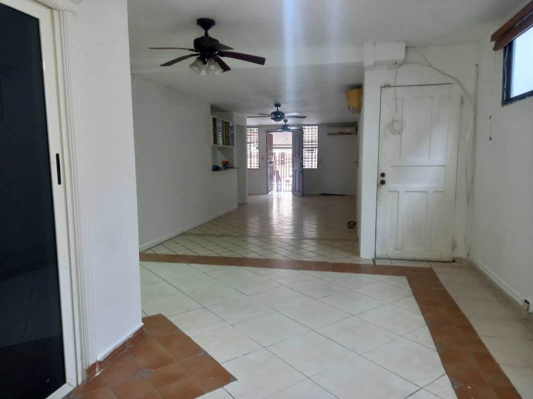 Bedroom with built-in closets, window security bars in Condado del Rey home Panama City