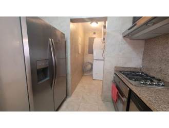 Modern kitchen with appliances and granite-look countertops in Tucán Country Club Cocolí