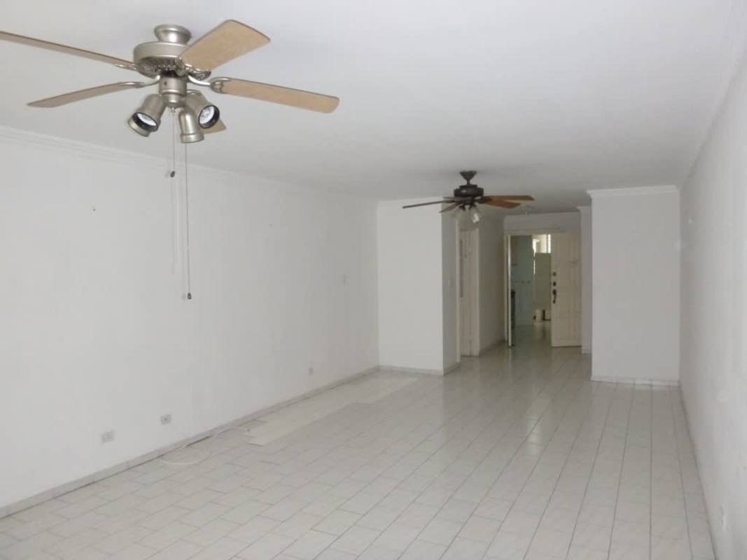 Spacious empty living room with large windows, ceramic floors, ceiling fan at PH Ocean View San Francisco Panama