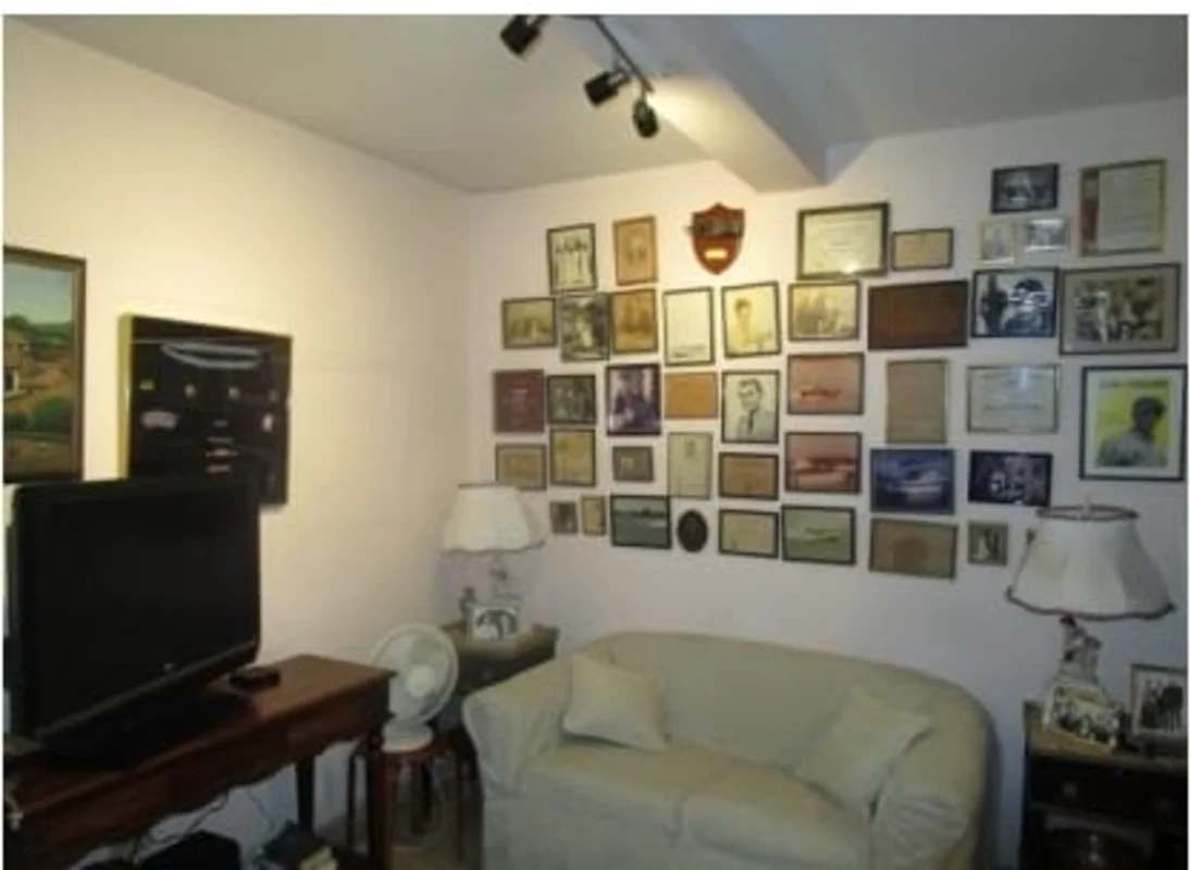 Living space with wall decor, sofa, classic furnishings in Panama house for sale