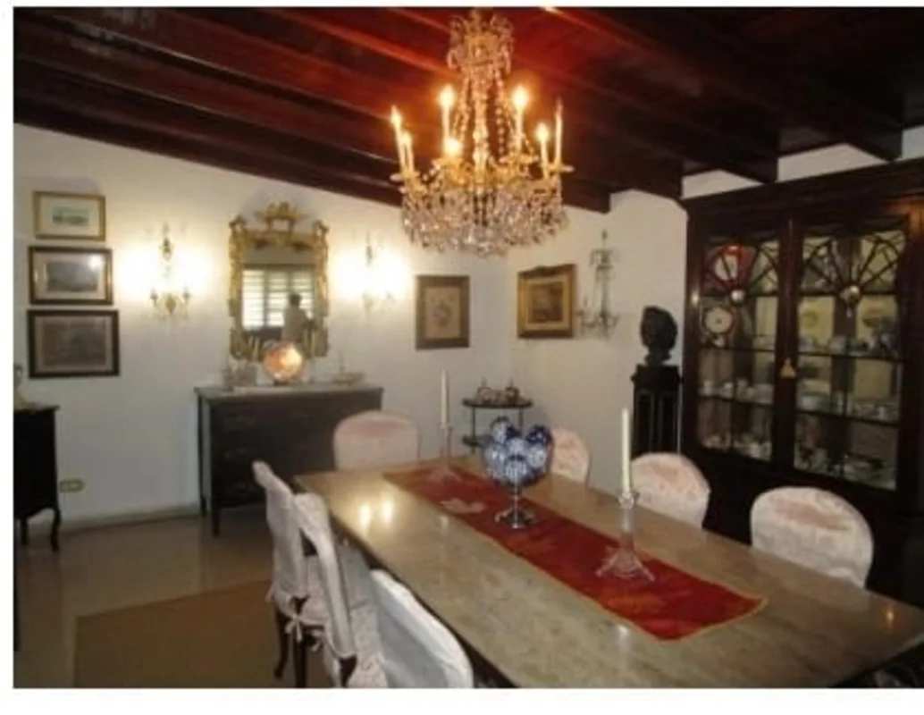 Formal dining room with wood beams, chandelier, classic decor San Francisco house