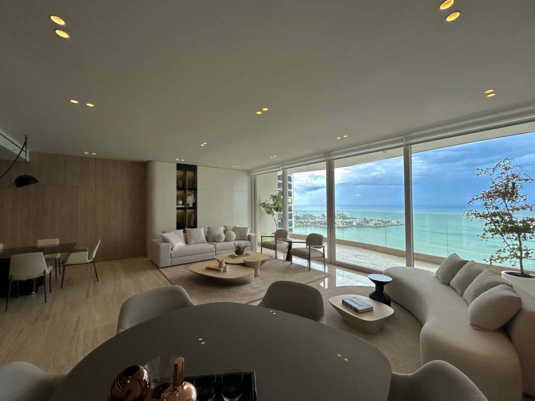 Modern dining room area with floor-to-ceiling sea views in The Towers Punta Paitilla Panama