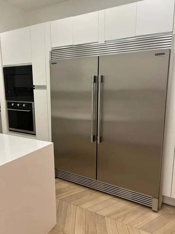 Modern kitchen with island, stainless appliances, quartz counters at PH Ocean Reef Panama City