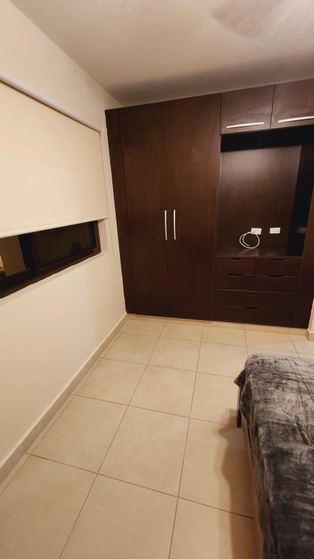 Bathroom with glass shower and double sink Embassy Club Clayton