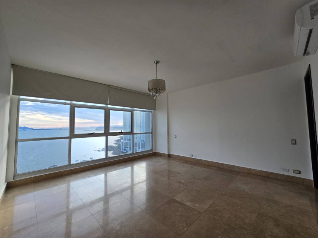 Bonus family/TV lounge with marble floors inside oceanview apartment Q Tower Panama