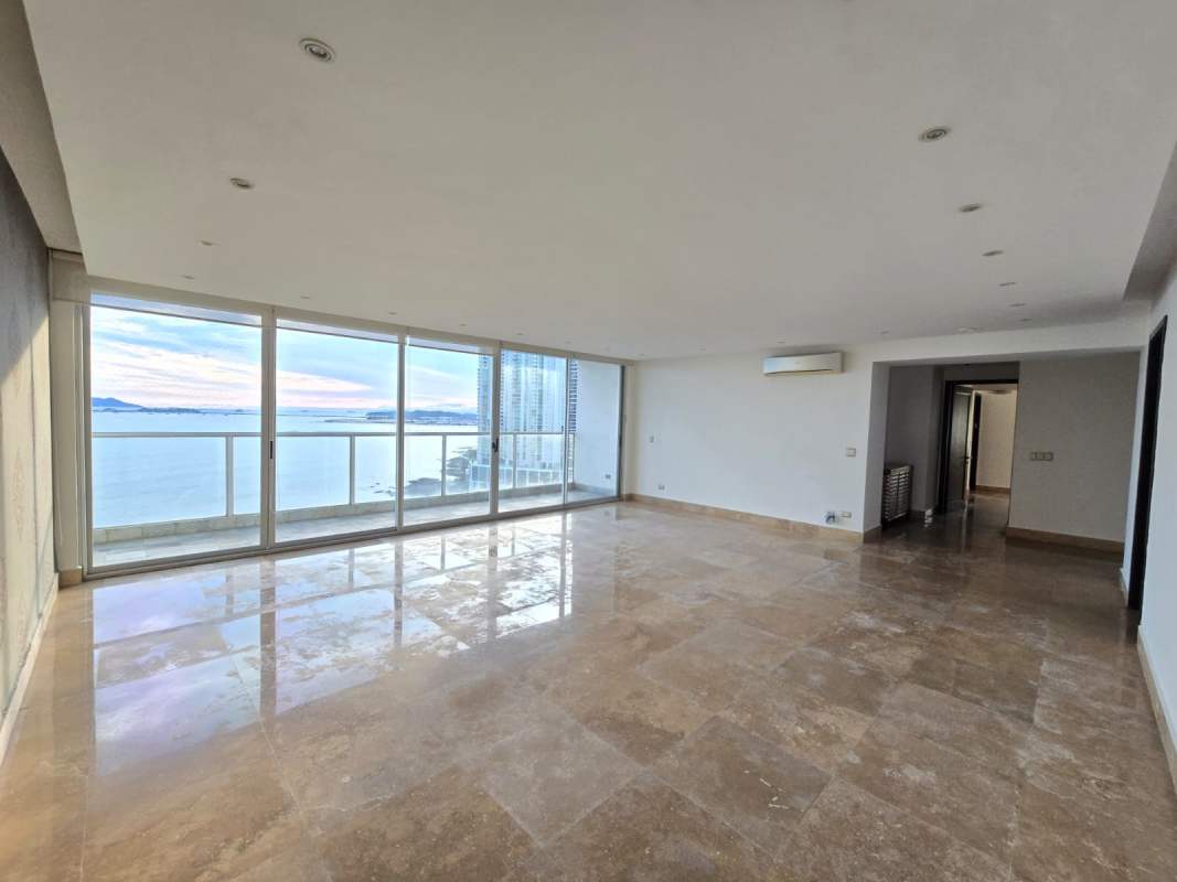 Master suite with marble floors, ocean view windows, and ample closet in Q Tower Punta Pacifica Panama