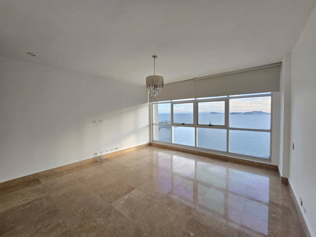 Master bathroom with tub, marble finishes, double vanity with ocean view window at Q Tower Punta Pacifica Panama