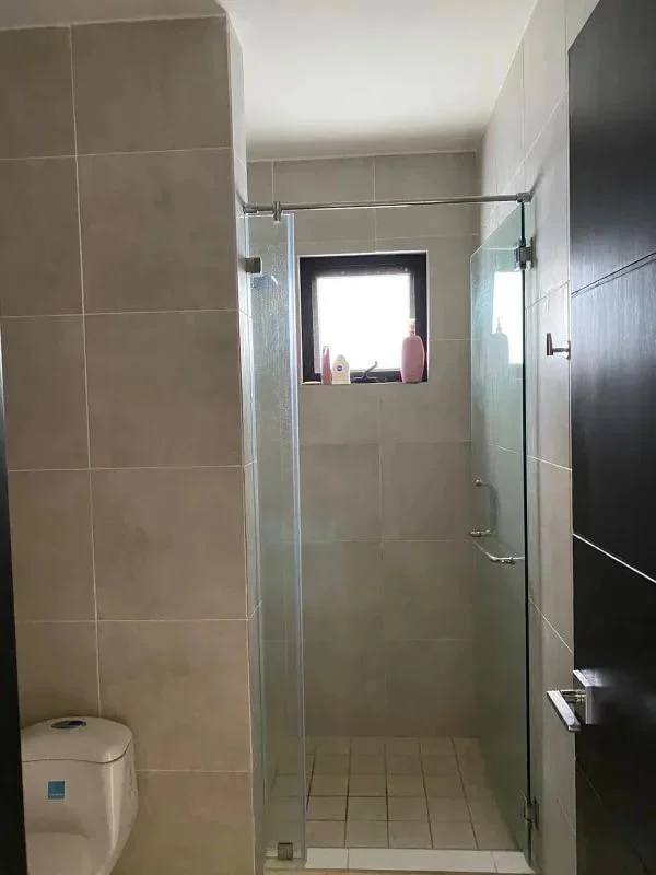 Open kitchen with granite countertops, appliances, and breakfast bar at PH Embassy Village Albrook Panama