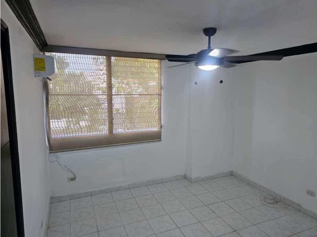 Minimalist bedroom with window blinds, AC unit, ceiling fan, and tiled floor