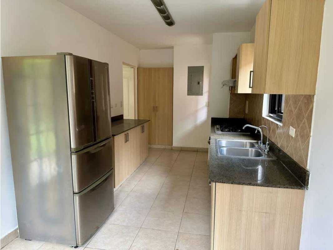 Modern kitchen with granite counters, wood cabinets and stainless appliances PH Versalles Panama City