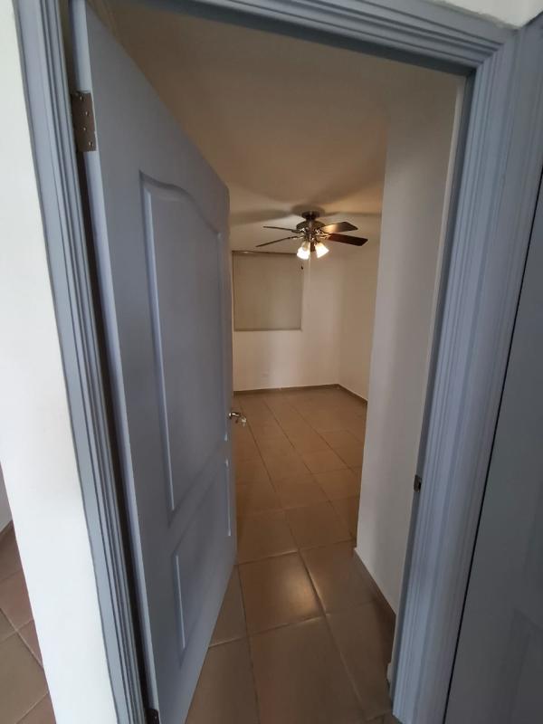 Second bedroom with ceiling fan and windows in PH Pueblo Nuevo Panama