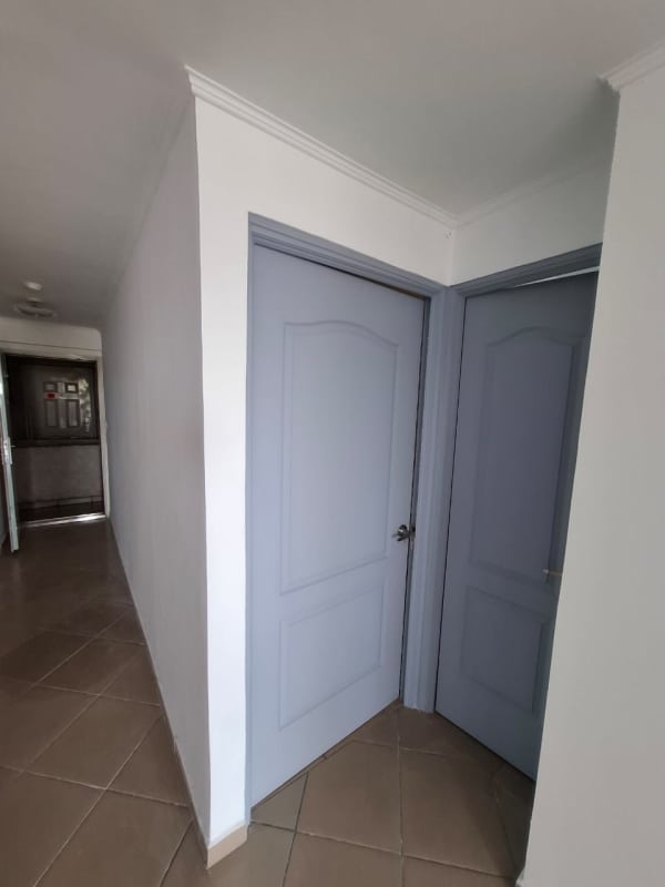 Small balcony with iron railing overlooking Pueblo Nuevo Panama City