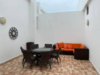 Bedroom with built-in closets balcony access natural light Playa Blanca penthouse