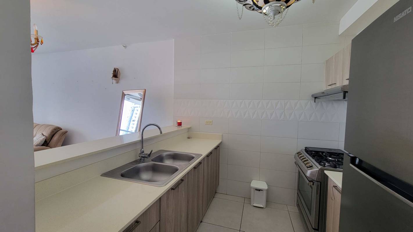 Modern living room with sliding glass doors to balcony PH Vivendi Green Edison Park Panama