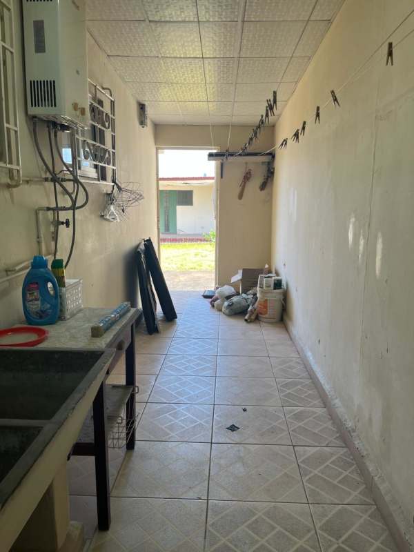 Laundry room with utility sink water heater and tiled floors Pedregalito Juan Diaz Panama