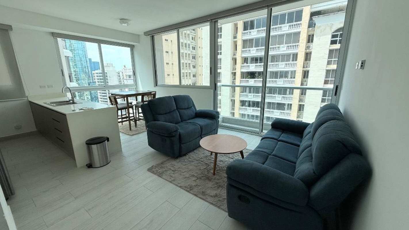 Open living dining area with city view balcony in PH Urbana Obarrio Panama